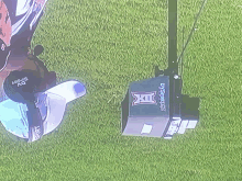 a box with a texas logo on it is on the grass