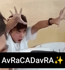 a picture of a boy with his hands up and the words avracadvra