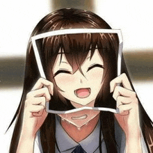 a girl with long brown hair is holding a picture frame in front of her face .