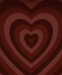 a dark brown background with a heart in the middle