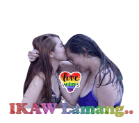 two women kissing in front of a sign that says love wins ikaw lamang