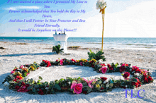 a heart shaped wreath of flowers on a beach with a quote