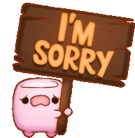 a sign that says i 'm sorry is being held by a pink marshmallow