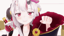 a girl with white hair and red eyes is holding a coin in her hand