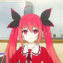 a girl with long red hair has a bow in her hair