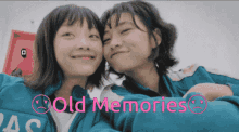 two girls are posing for a picture with the words old memories written below them