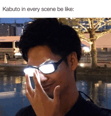 a man wearing a pair of glowing glasses with a caption that says kabuto in every scene be like