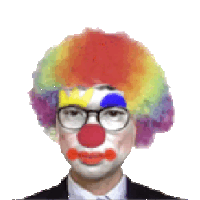 a man in a suit and tie is dressed as a clown with glasses and a colorful wig .