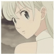 a close up of a girl with blonde hair and blue eyes from the seven deadly sins .