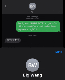 a phone screen shows a text message from bw big wang