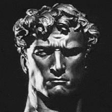 a black and white drawing of a statue of a man 's head with curly hair .