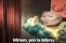 a cartoon character with a big head is standing in front of a red curtain and says miriam , pon la tetera .