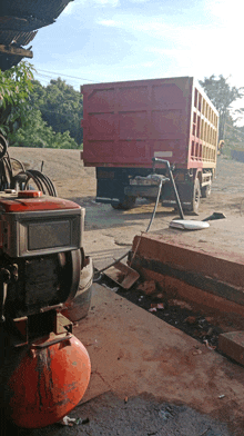 a red dump truck with a license plate that says ' a ' on it