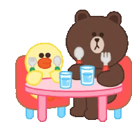 a brown bear and a yellow duck are sitting at a table eating and drinking .