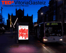 a tedx vitoriagasteiz poster with a bus in the background