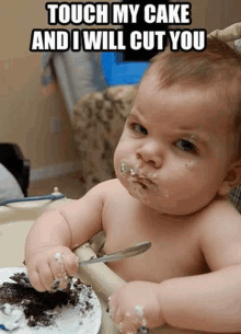 a baby is sitting in a high chair with cake on his face and a caption that says touch my cake