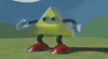 a yellow triangle with red feet and arms is standing on a grassy field .