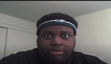 a man wearing a headband with the eagles on it