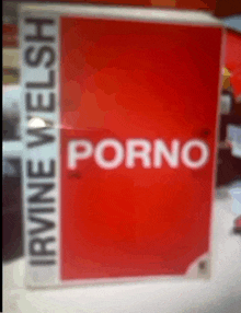 a book by irvine welsh called porno is on a table