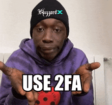 a man wearing a purple hoodie and a black beanie is holding a red ball and says use 2fa