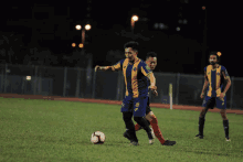 a soccer player wearing a blue and yellow uniform with the number 5 on it