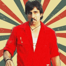 a man in a red shirt with a mustache is standing in front of a striped background