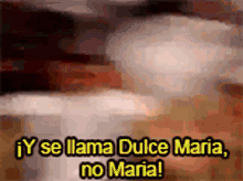 a blurred image of a person with the words " y se llama dulce maria no maria "