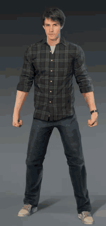 a man wearing a plaid shirt and jeans stands with his fist in the air