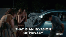 a netflix ad shows a woman covering her face while a man looks into a car