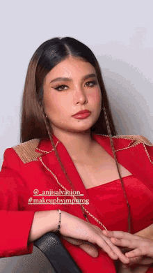 a woman wearing a red jacket has the hashtag makeupbyjmparog on the bottom