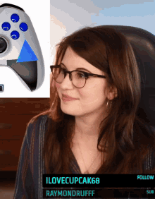 a woman wearing glasses is sitting in front of a video game controller with the name raymondrufff on the bottom