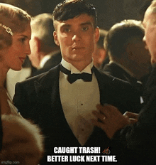 a man in a tuxedo is talking to a woman in a crowd with the caption " caught trash better luck next time "