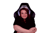 a woman is sitting in an akracing chair