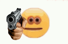 a hand holding a gun in front of an emoji