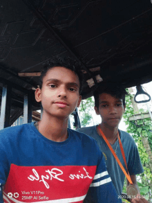 two boys pose for a selfie with a vivo v11 pro