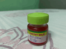 a small bottle of sastry balm is sitting on a table