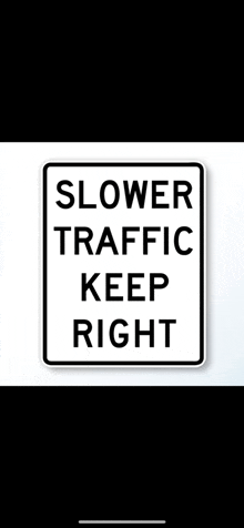 a sign that says slower traffic keep right on a white background