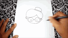 a person is drawing an old lady with glasses and a top hat on a piece of paper