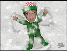 a cartoon of a girl wearing a green pajama suit and a red and white hat