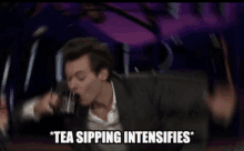 a man in a suit is drinking from a cup with the words tea sipping intensifies below him