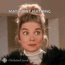 a woman is making a funny face with the caption math aint matching