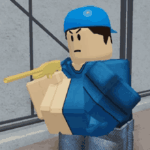 a man in a blue hat is holding a gun in his hand