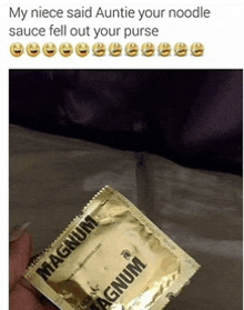 someone is holding a magnum condom in front of a bed