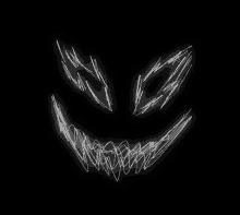 a drawing of a scary face with sharp teeth on a black background