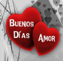 two red hearts that say buenos dias amor