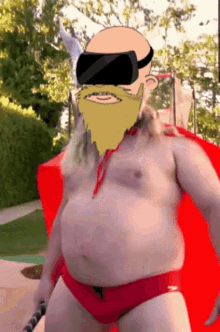 a man with a beard wearing a virtual reality headset and red swim trunks