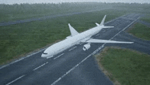 a white airplane is taking off from an airport runway .