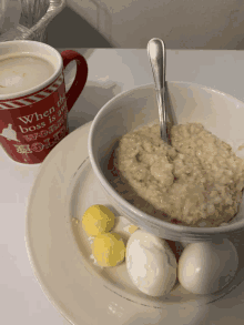 a bowl of oatmeal next to a mug that says when the boss is away