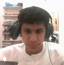 a man wearing headphones with the name ducky ucky written on the bottom