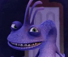 a close up of a purple cartoon character from monsters inc smiling and looking at the camera .